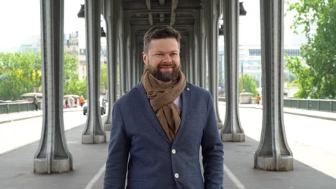Young man is walking under the bridge of Bir-Hakeim in Paris Stock Footage 107433272