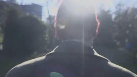 Young Man Walking wearing Red hat, Slow Motion, Stock Footage 71576002