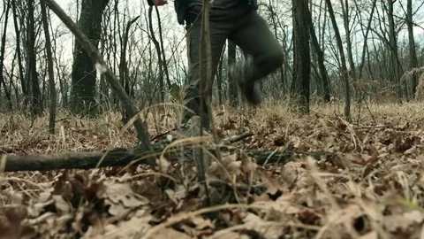 Young man walking in the woods Stock Footage 71211975