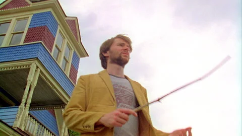 A young man walks down the street in on old town, Monticello, NY 1989. Stock Footage 272257045