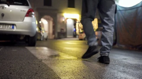 A young man walks in Rome's suburbs in the night Stock Footage 101357557