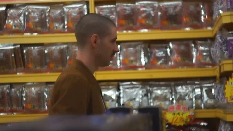 A young man walks up store. Stock Footage 85575948