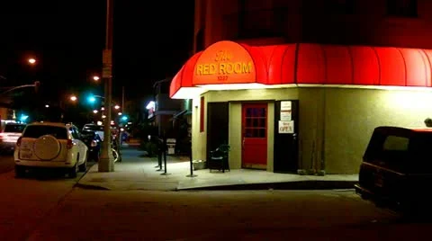 Young Man Walks Into A Tavern At Night Stock Footage