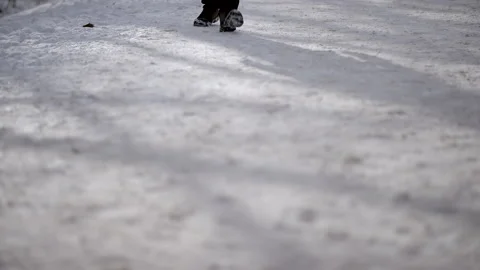 Young Man Walks through Beautiful Snowy Park in the Morning Stock-Footage 148490457