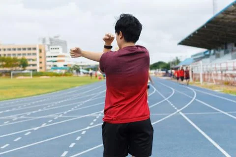 Young man warm up before running. exercise concept. Warm up concept. workout  Stock Photos