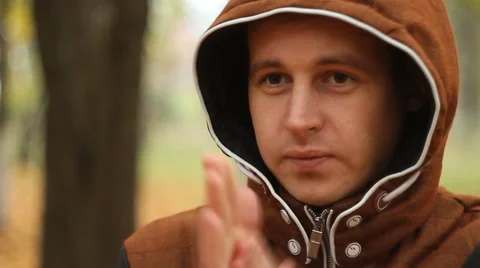 The young man warming his hands Stock Footage 68740271