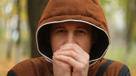 The young man warming his hands Stock Footage 68740488