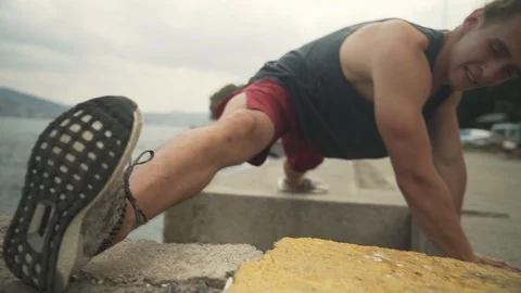 Young man is warming up for a  training on Halich bridge  in Istanbul. Stock Footage 123836882