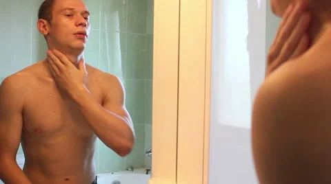Young man washing face Stock Footage 55533897
