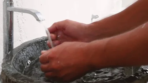 Young man washing face Stock Footage 73787464