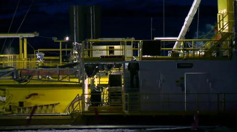 Young man watching a fracking operation Stock Footage 47938928