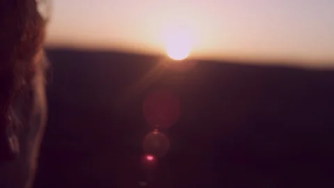 Young man watching the sunset over a beautiful view of British Valley  Stock Footage 85656177