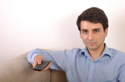 Young man watching televison Stock Photos