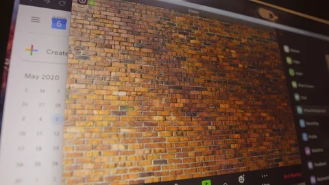 Young man waves to camera for remote work video conference call 스톡 동영상 129853476