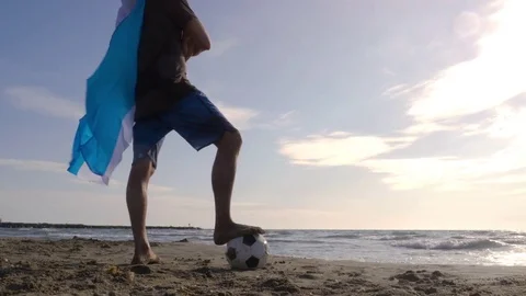 Young man wearing argentinian argentina national flag as super hero cape stands Video stock 85071653