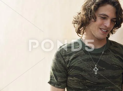 Young Man Wearing Cross Shape Necklace Stock Photos