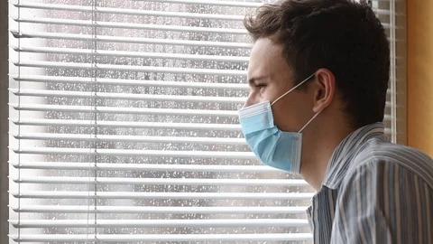Young man wearing a face mask Stock Footage 126100394