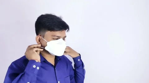 Young man wearing face mask Stock Footage 139097768