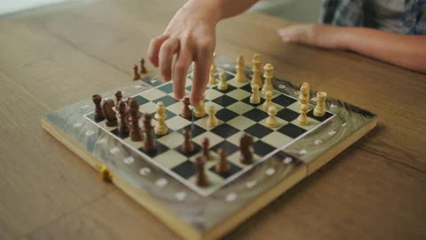 Young Man Wearing Glasses Plays Chess Alone With Himself At Home Stock Footage 145321386
