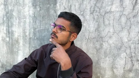 Young Man Wearing Glasses Thinking Deeply – Pensive Male Model Concept Видео 321388415