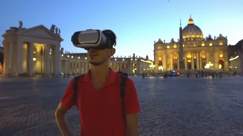 Young man wearing virtual reality headset in St. Peter's basilica, Rome, Italy. Stock Footage 80433718