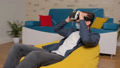 Young man wearing virtual reality headset. Augmented Reality. Stock Footage 140715013