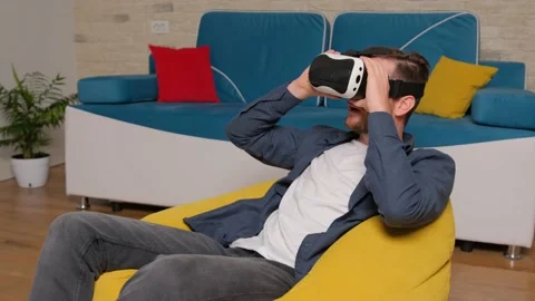 Young man wearing virtual reality headset. Augmented Reality. Stock Footage 140910261
