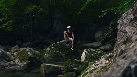 Young man wearing VR glasses and discovering simulating new forest nature world Stock Footage 104270462