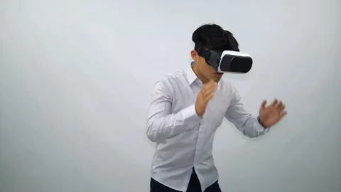 Young Man Wearing VR Headset on a White Background Stock-Footage 71443712