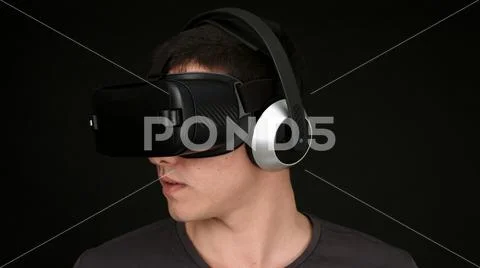 Young Man Wearing VR Headset And Experiencing Virtual Reality Stock Photos