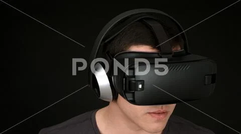 Young Man Wearing VR Headset And Experiencing Virtual Reality Stock Photos