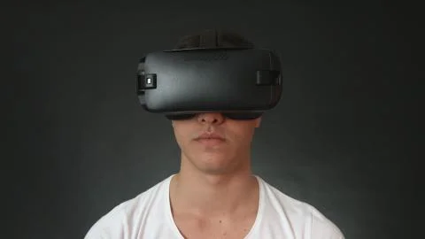 Young Man Wearing VR Headset And Experiencing Virtual Reality Stock Photos