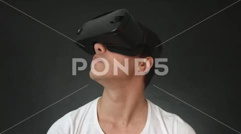 Young Man Wearing VR Headset And Experiencing Virtual Reality Stock Photos