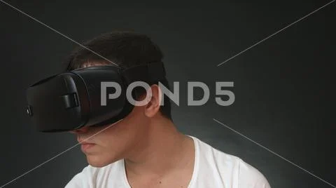 Young Man Wearing VR Headset And Experiencing Virtual Reality Stock Photos