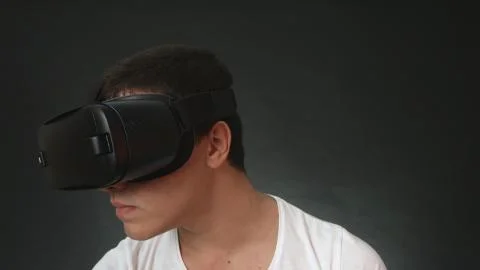 Young Man Wearing VR Headset And Experiencing Virtual Reality Stock Photos
