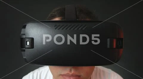 Young Man Wearing VR Headset And Experiencing Virtual Reality Stock Photos