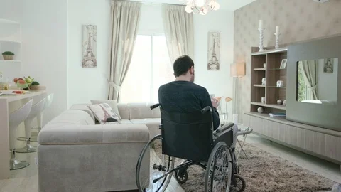 Young man in a wheelchair  Stock Footage 120567810