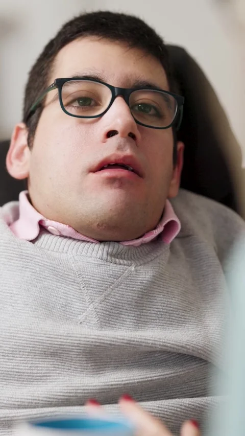 Young man in wheelchair having a speech therapy session Stock Footage 333411705