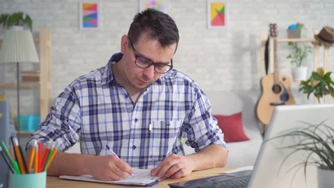 Young man while working on a laptop had a nosebleed Stock Footage 105686959