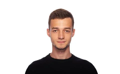 A young man on a white background. Stock Photos