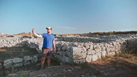 Young man in white baseball cap takes a selfie on smartphone. Stock Footage 195525295