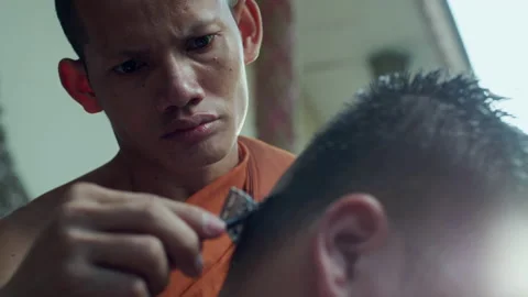 The young man whose head was shaved during the ordination ceremony Stock Footage 134362276