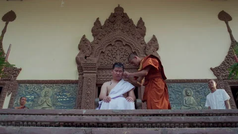 The young man whose head was shaved during the ordination ceremony Stock Footage 134365128