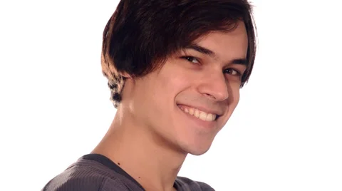 Young man winking and smiling 库存影片 29991122