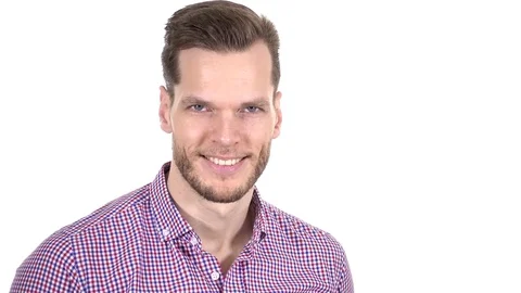 Young man winking and smiling Stock Footage 84063361