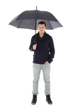 Young man in winter clothes posing with umbrella isolated on white Stock Photos