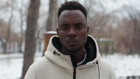 Young Man in Winter Jacket with Bold Look Outdoors Stock Footage 305626763