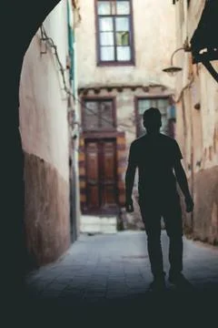 Young man wondering and lost in the alleys. Stock Photos