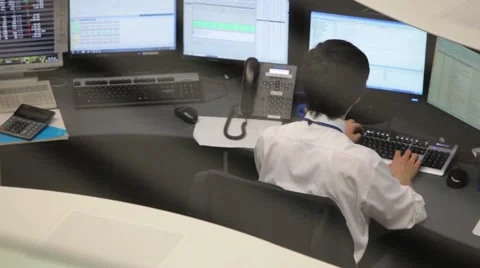 A YOUNG MAN AT WORK IN THE OFFICE OF TOKYO STOCK EXCHANGE IN TOKYO JAPAN Video stock 59922194