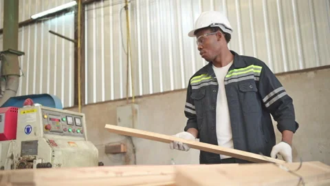 Young man worker work in a woodworking factory, Stock Footage 253888971